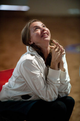 woman looking up at the sky with inspiration